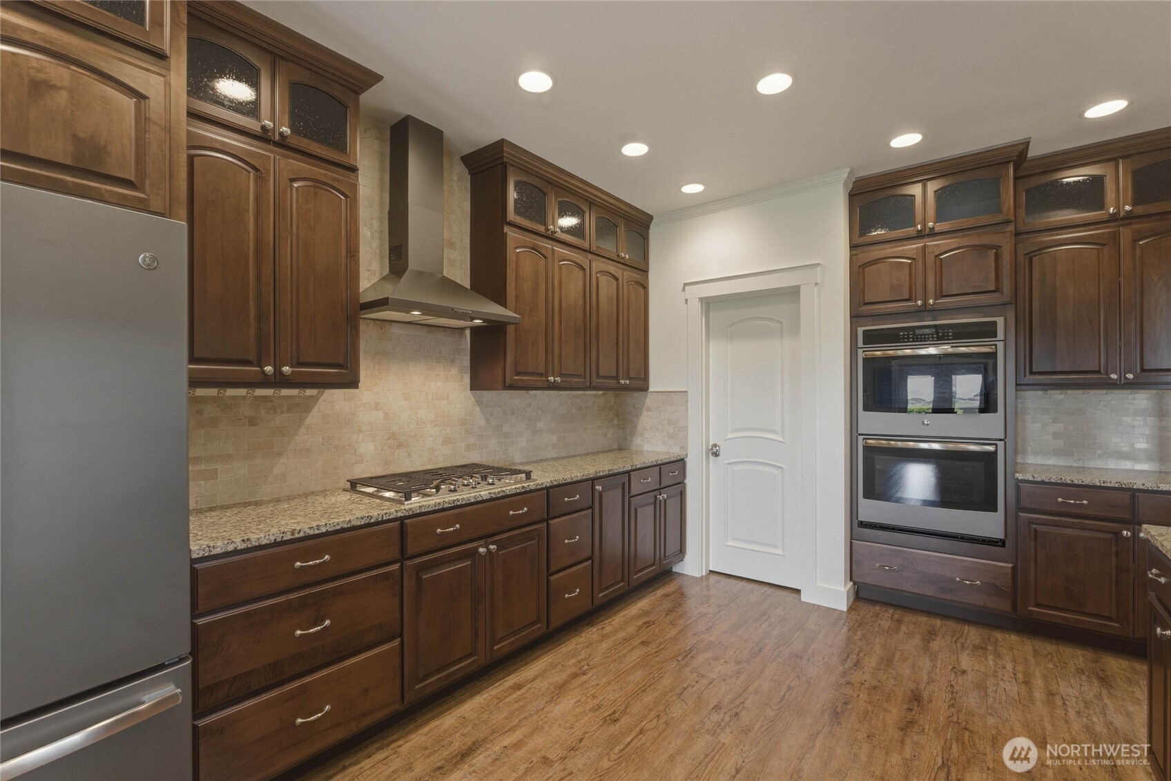 726 L Street Southwest Quincy, WA 98848 - Photo 13 of 40 a kitchen with stainless steel appliances granite countertop a refrigerator and a stove top oven