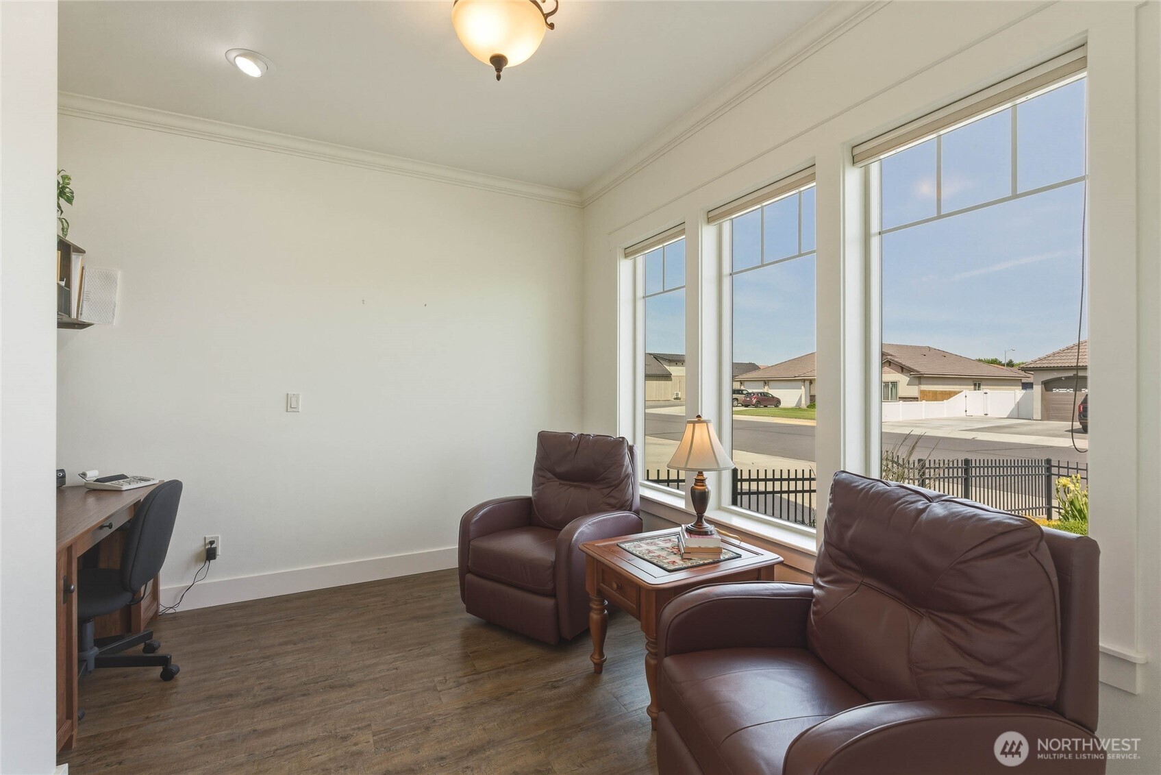 726 L Street Southwest Quincy, WA 98848 - Photo 15 of 40 a living room with furniture two windows and a flat screen tv
