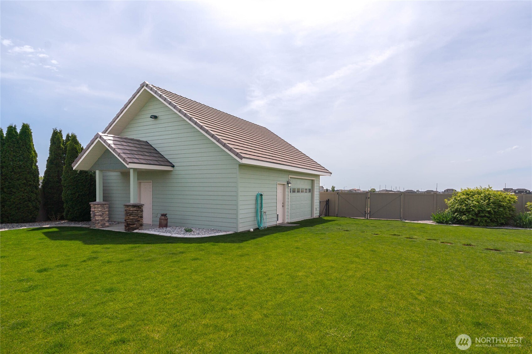 726 L Street Southwest Quincy, WA 98848 - Photo 21 of 40 a view of a house with a yard