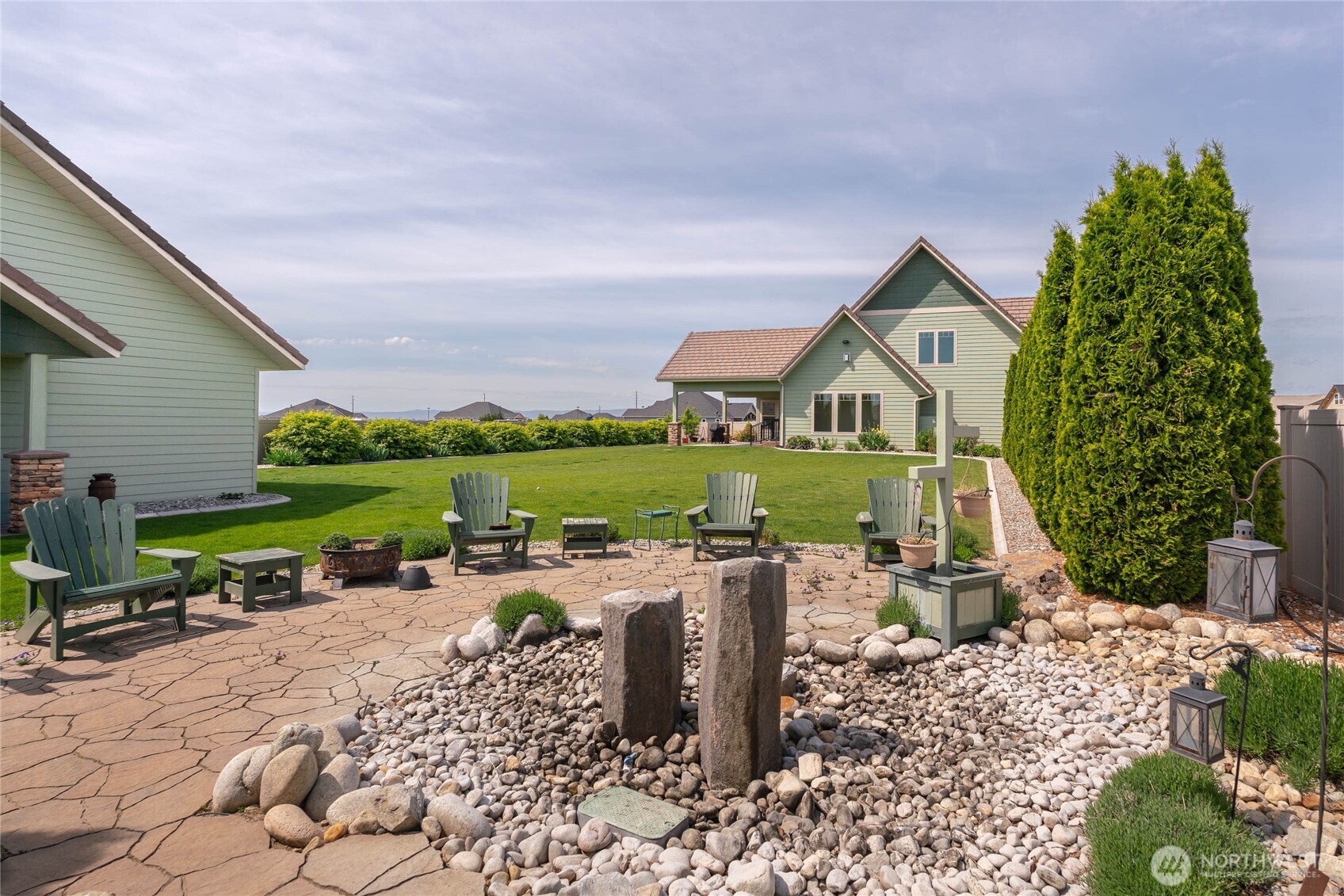 726 L Street Southwest Quincy, WA 98848 - Photo 23 of 40 a view of house with backyard outdoor seating and green space
