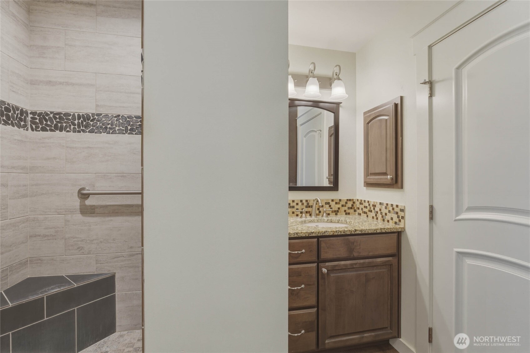 726 L Street Southwest Quincy, WA 98848 - Photo 28 of 40 a bathroom with a sink a mirror and shower