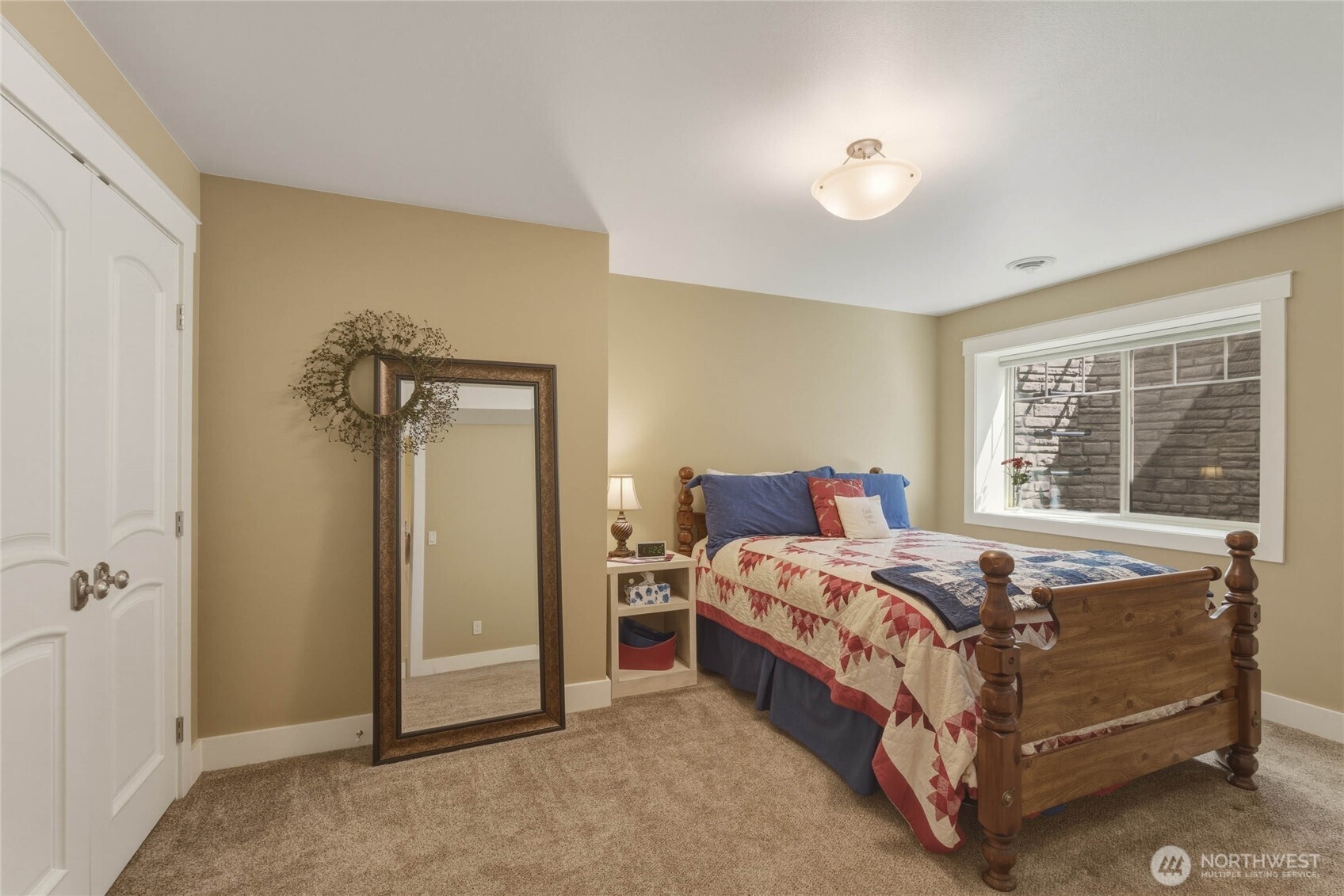 726 L Street Southwest Quincy, WA 98848 - Photo 29 of 40 a bed sitting in a bedroom next to a window