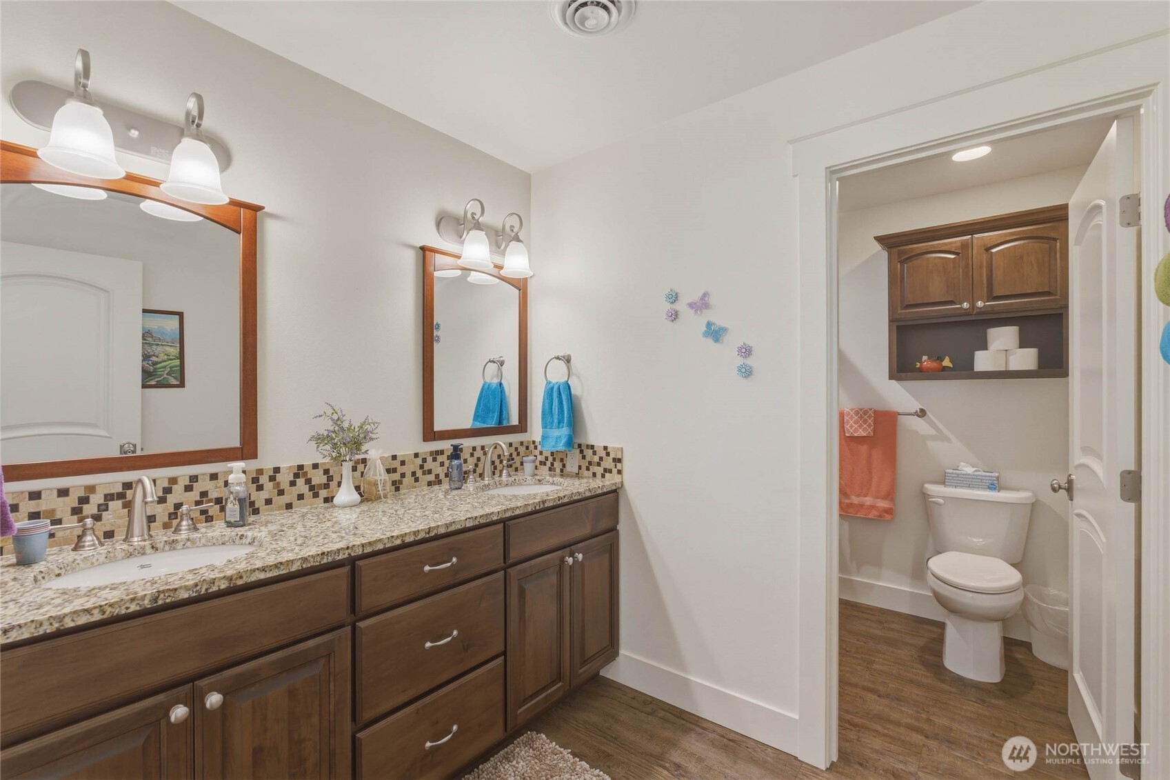726 L Street Southwest Quincy, WA 98848 - Photo 35 of 40 a bathroom with a granite countertop sink a toilet and a mirror