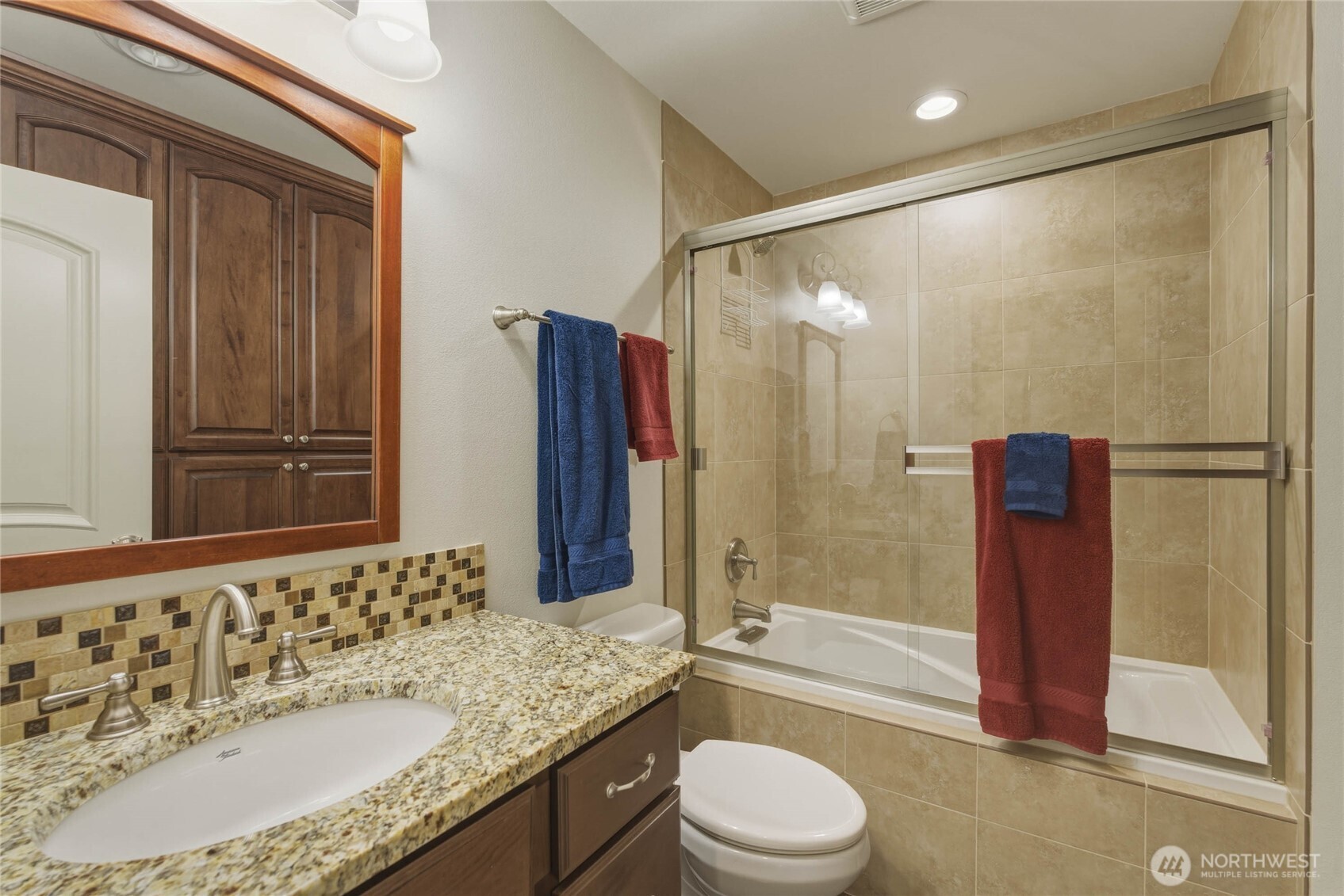 726 L Street Southwest Quincy, WA 98848 - Photo 40 of 40 a bathroom with a granite countertop sink toilet and shower