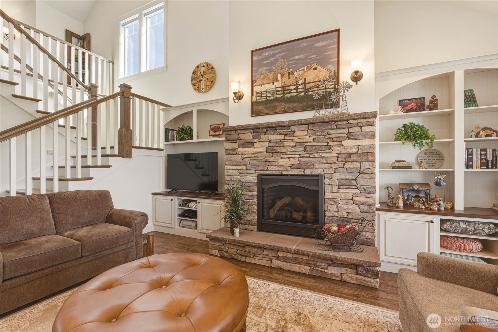 726 L Street Southwest Quincy, WA 98848 - Photo 9 of 40 a living room with furniture a flat screen tv and a fireplace