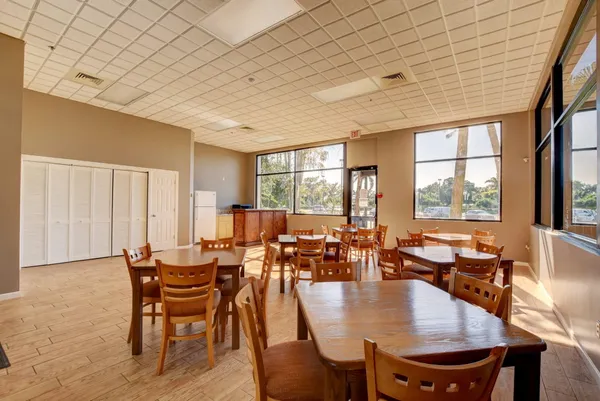 an aerial view of a house with a yard and swimming pool