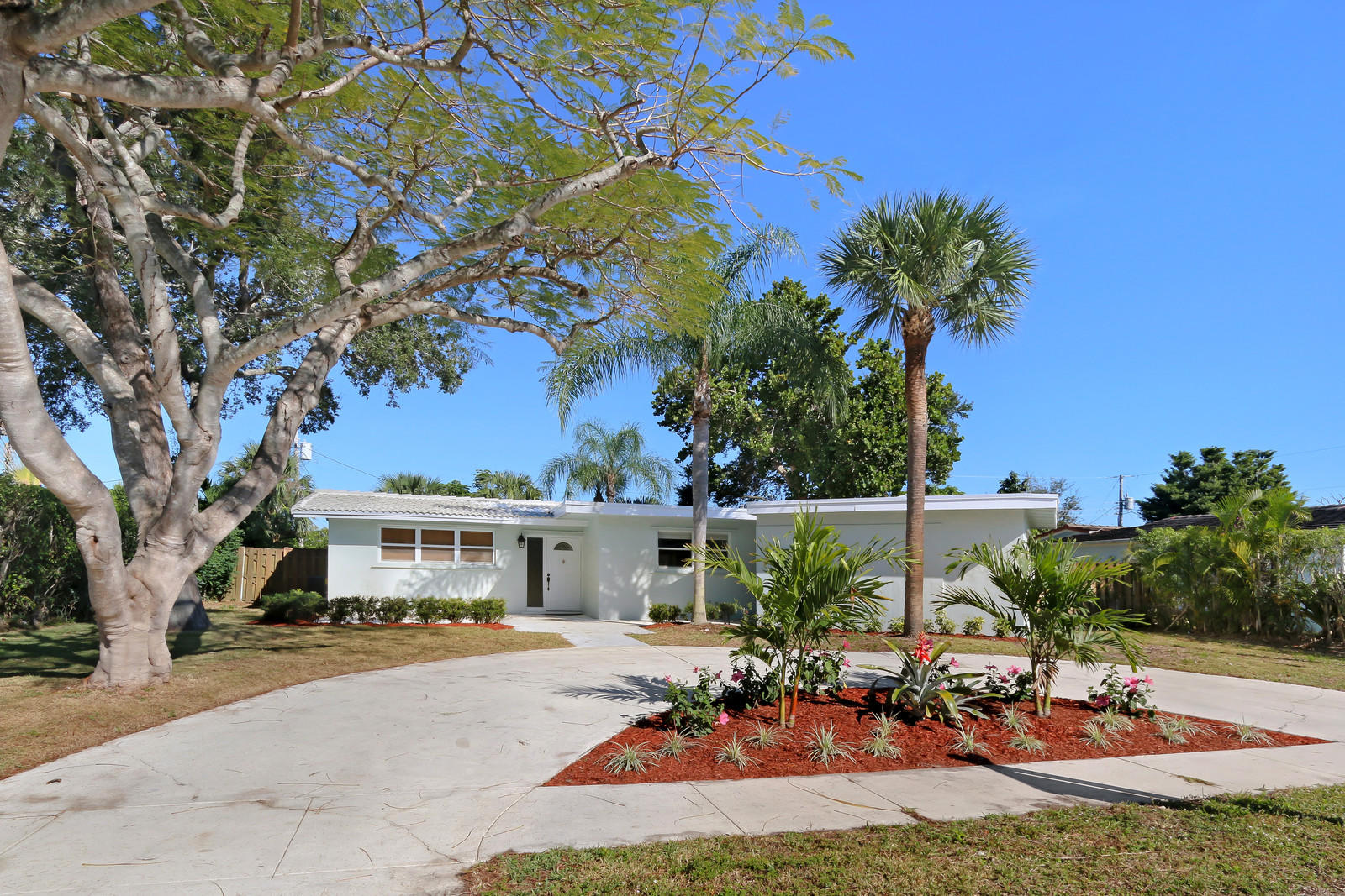 1329 Northwest 6th Street Boca Raton, FL 33486 - Photo 1 of 27 a view of a house with backyard and sitting area