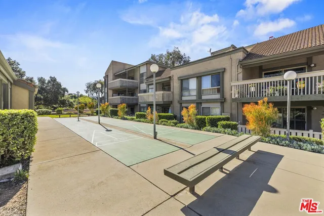 a view of a building with a yard