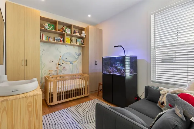 a bedroom with furniture and a window