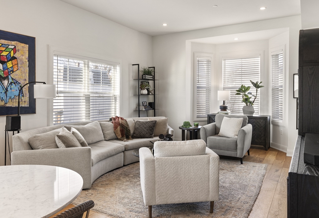 157 Princeton Street, Unit 2 Boston, MA 02128 - Photo 5 of 22 a living room with furniture and a large window