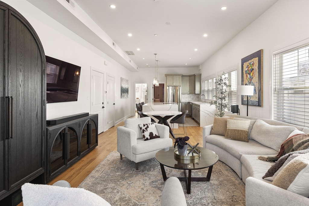 157 Princeton Street, Unit 2 Boston, MA 02128 - Photo 7 of 22 a living room with furniture fireplace and a window