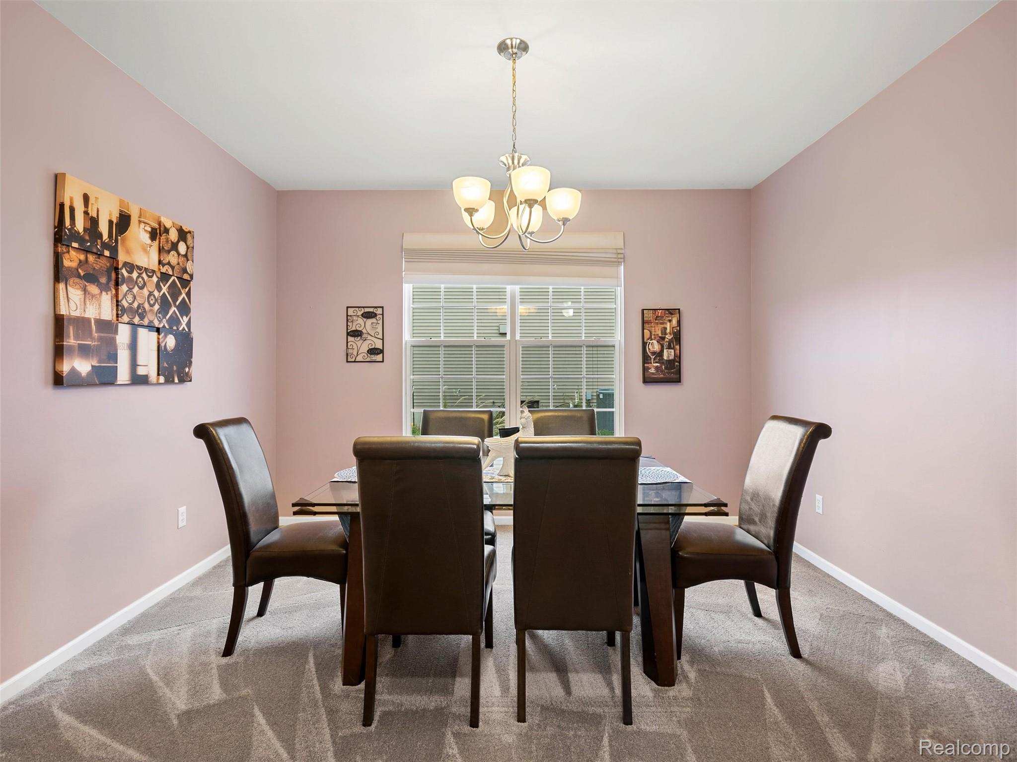 3191 Wren Lane Rochester, MI 48309 - Photo 12 of 63 Dining space with light carpet and a chandelier