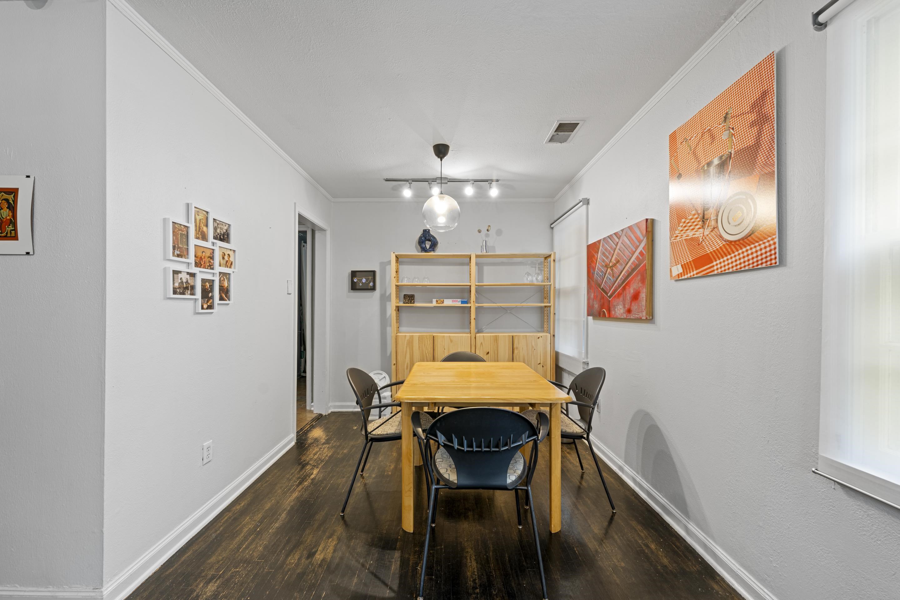 1343 Dearing Road Memphis, TN 38117 - Photo 5 of 19 Dining area featuring dark wood-finish flooring, white walls, and bright white trim