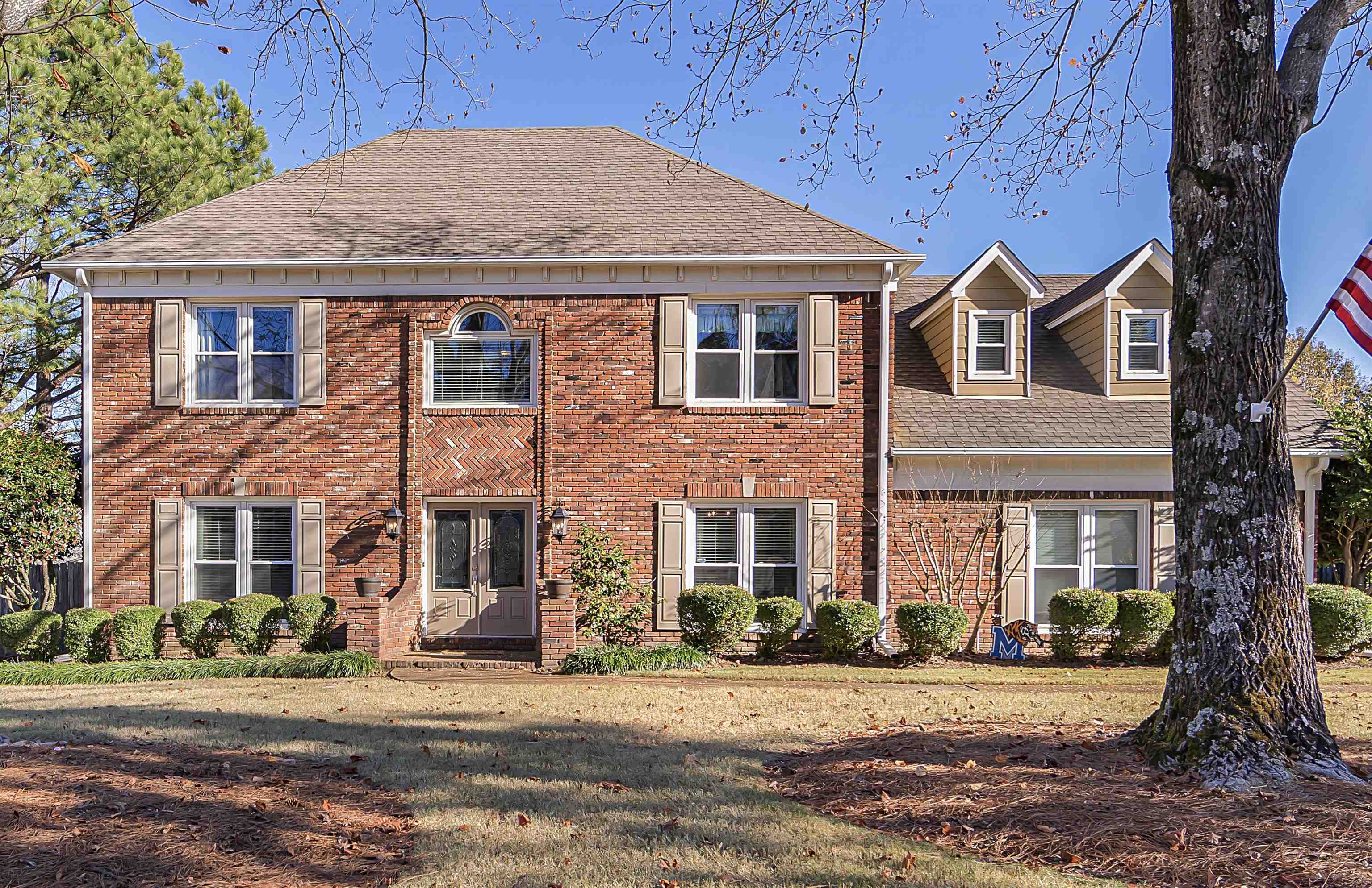 1213 Heather Ridge Cove Collierville, TN 38017 - Photo 1 of 25 a front view of a house with a yard