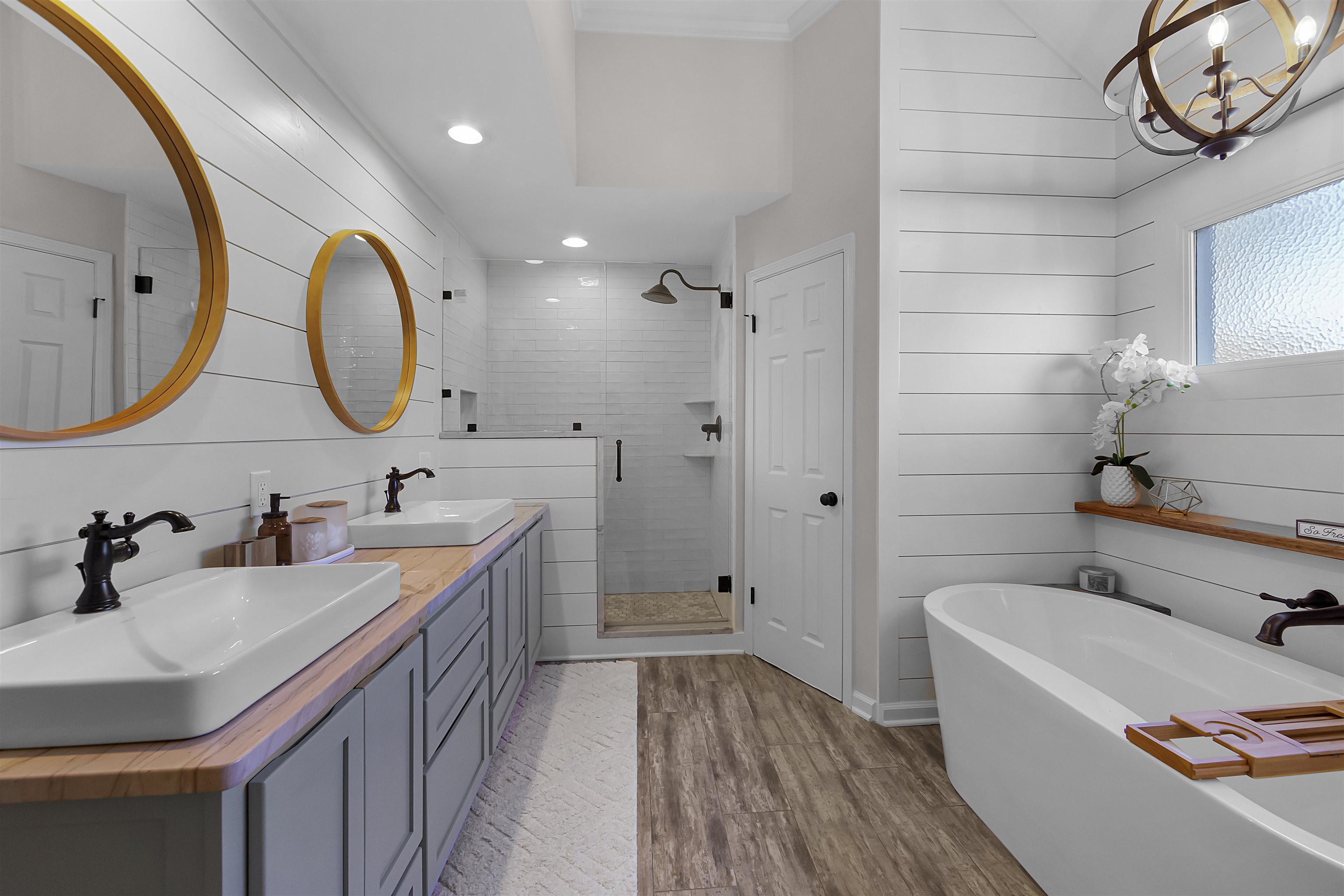 1213 Heather Ridge Cove Collierville, TN 38017 - Photo 14 of 25 a bathroom with a tub sink and mirror