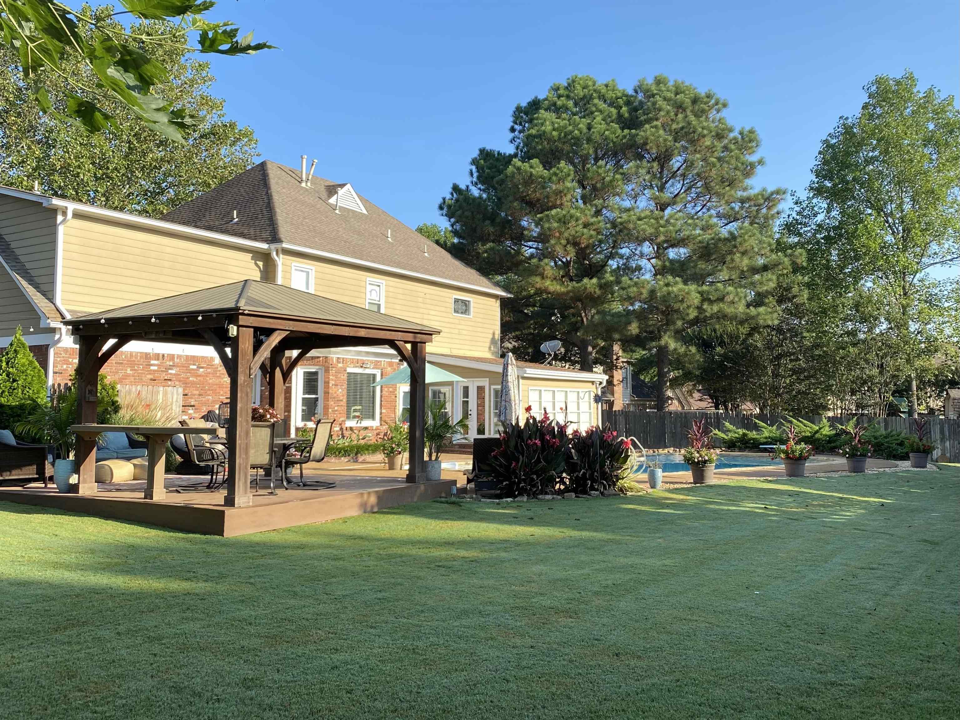 1213 Heather Ridge Cove Collierville, TN 38017 - Photo 25 of 25 a view of a building with a yard