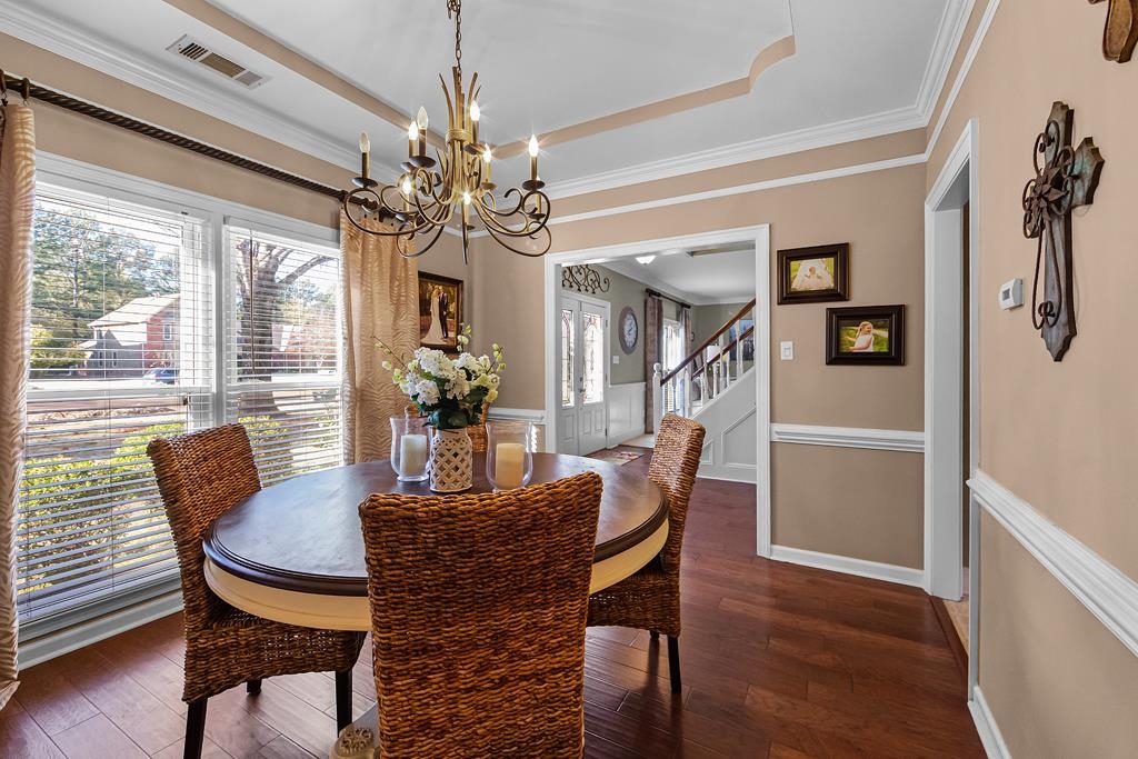 1213 Heather Ridge Cove Collierville, TN 38017 - Photo 5 of 25 a view of a dining room with furniture window and wooden floor