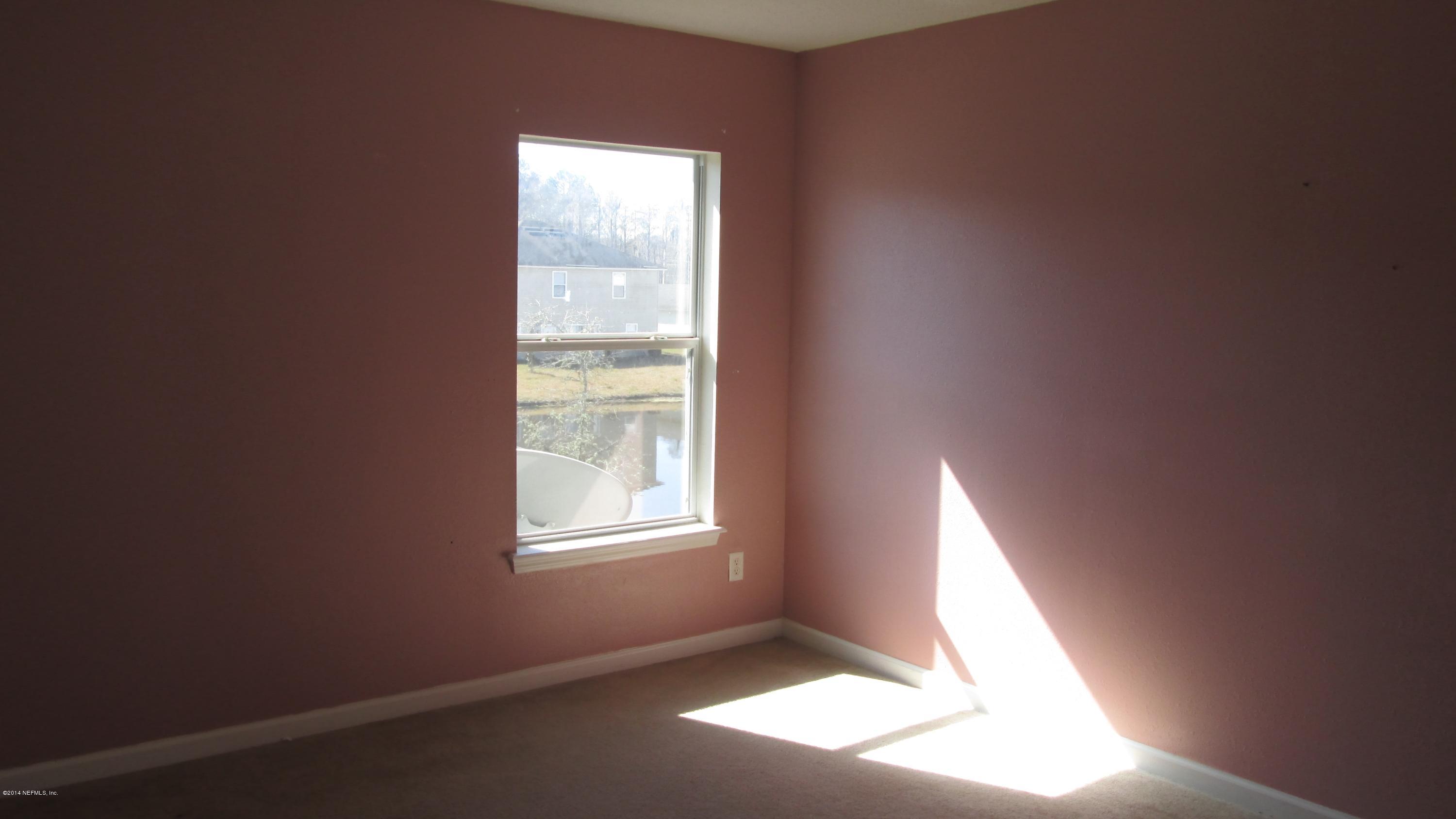 7201 Rampart Ridge Circle West Jacksonville, FL 32244 - Photo 12 of 14 an empty room with a window