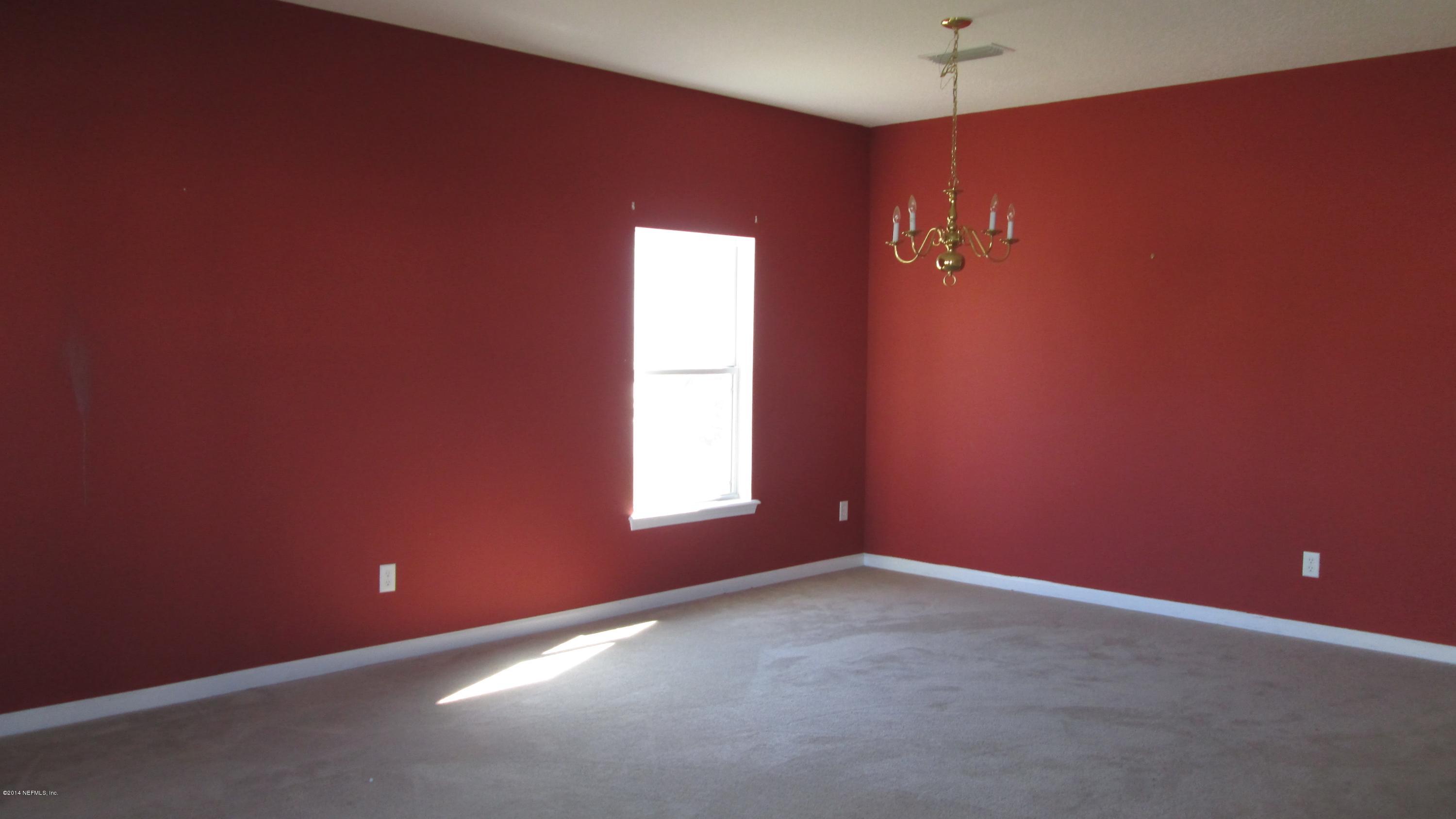 7201 Rampart Ridge Circle West Jacksonville, FL 32244 - Photo 5 of 14 a view of an empty room with a window