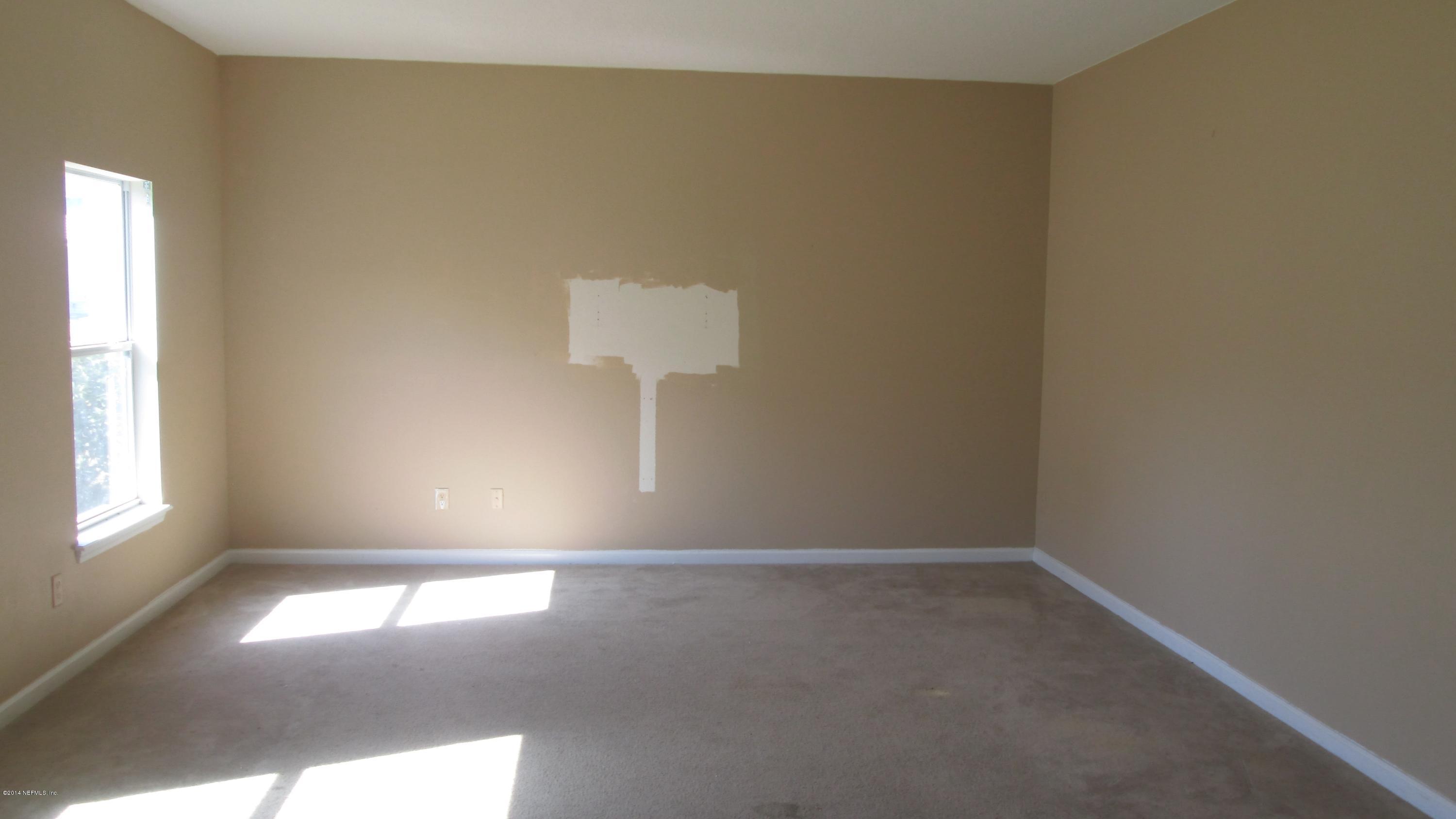 7201 Rampart Ridge Circle West Jacksonville, FL 32244 - Photo 6 of 14 an empty room with a window