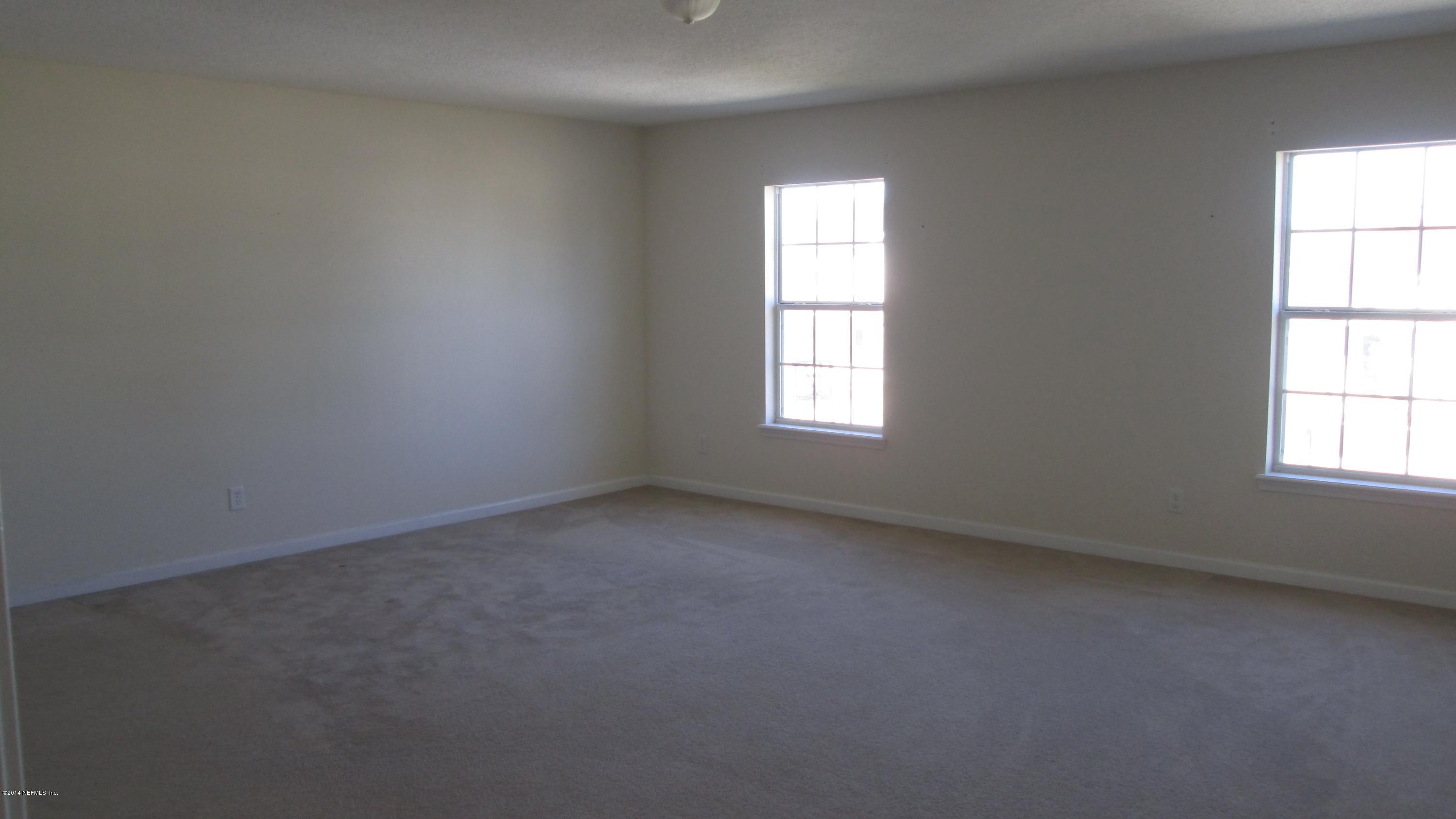 7201 Rampart Ridge Circle West Jacksonville, FL 32244 - Photo 7 of 14 an empty room with a window
