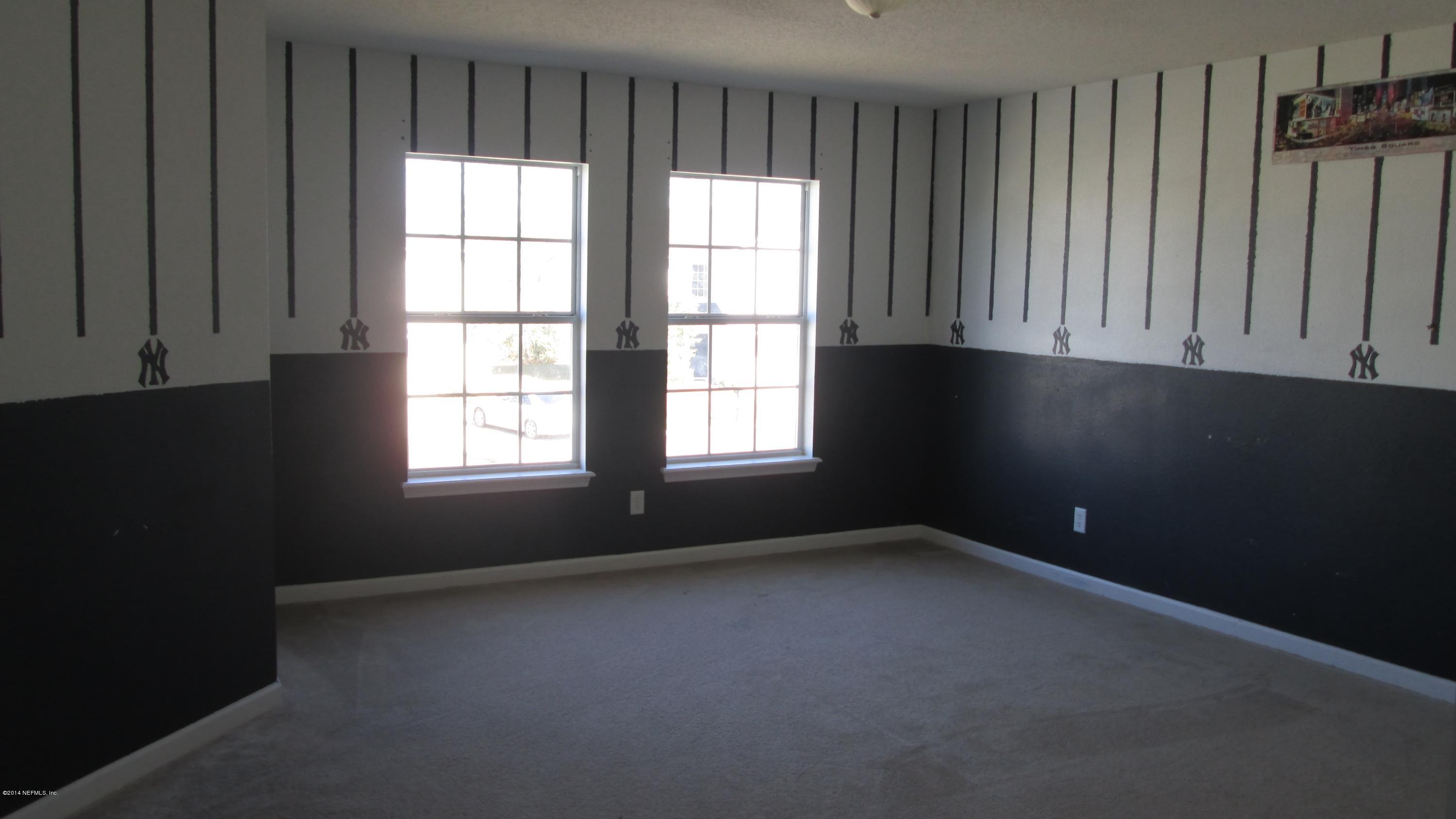 7201 Rampart Ridge Circle West Jacksonville, FL 32244 - Photo 10 of 14 a view of an empty room with a window