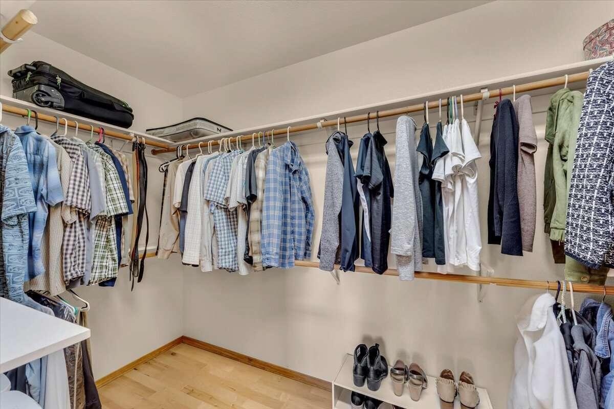 416 Arbor Place Redding, CA 96001 - Photo 12 of 31 a view of walk in closet with clothes and shoes