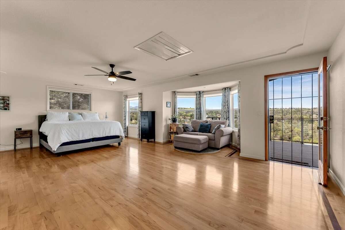 416 Arbor Place Redding, CA 96001 - Photo 15 of 31 a bedroom with furniture and a wooden floor