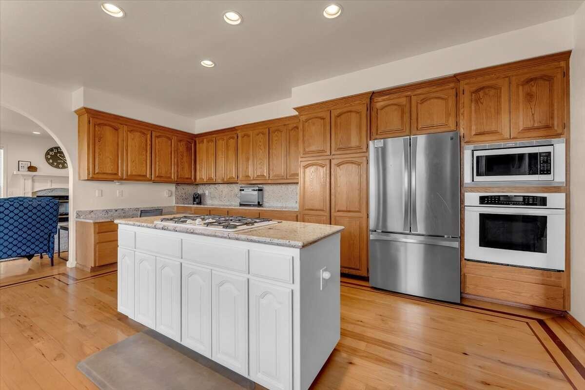 416 Arbor Place Redding, CA 96001 - Photo 18 of 31 a kitchen with stainless steel appliances granite countertop a refrigerator stove and oven