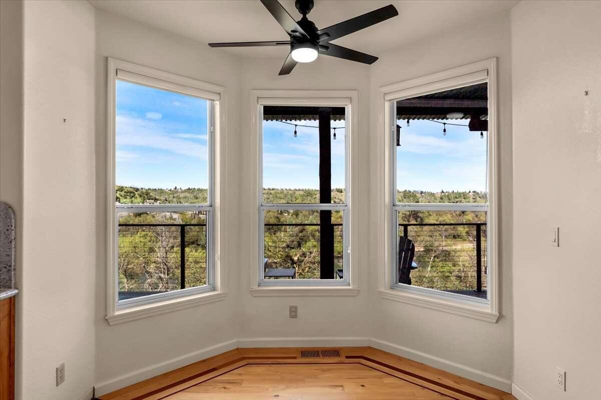 416 Arbor Place Redding, CA 96001 - Photo 19 of 31 a view of an empty room with a window and ceiling fan