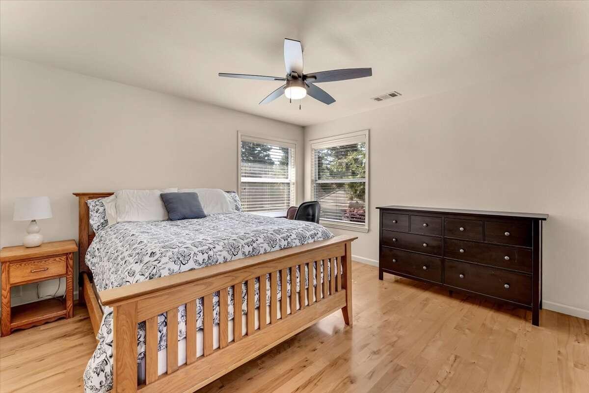 416 Arbor Place Redding, CA 96001 - Photo 25 of 31 a bedroom with a bed and a dresser