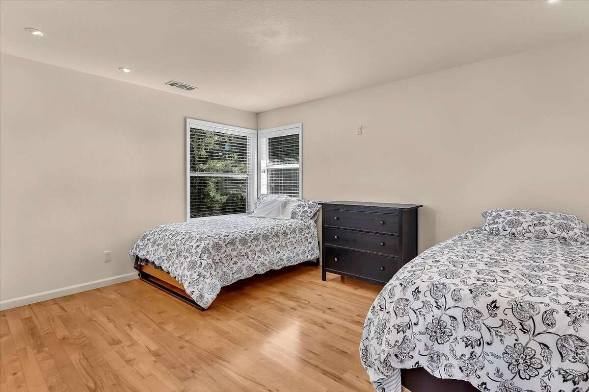 416 Arbor Place Redding, CA 96001 - Photo 26 of 31 a bedroom with a bed and a dresser
