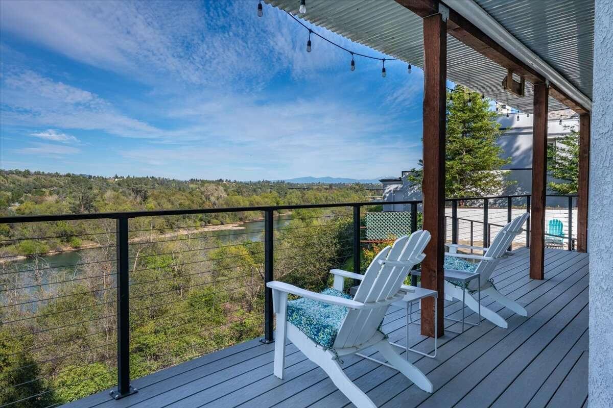 416 Arbor Place Redding, CA 96001 - Photo 29 of 31 a view of a balcony with chairs and wooden floor