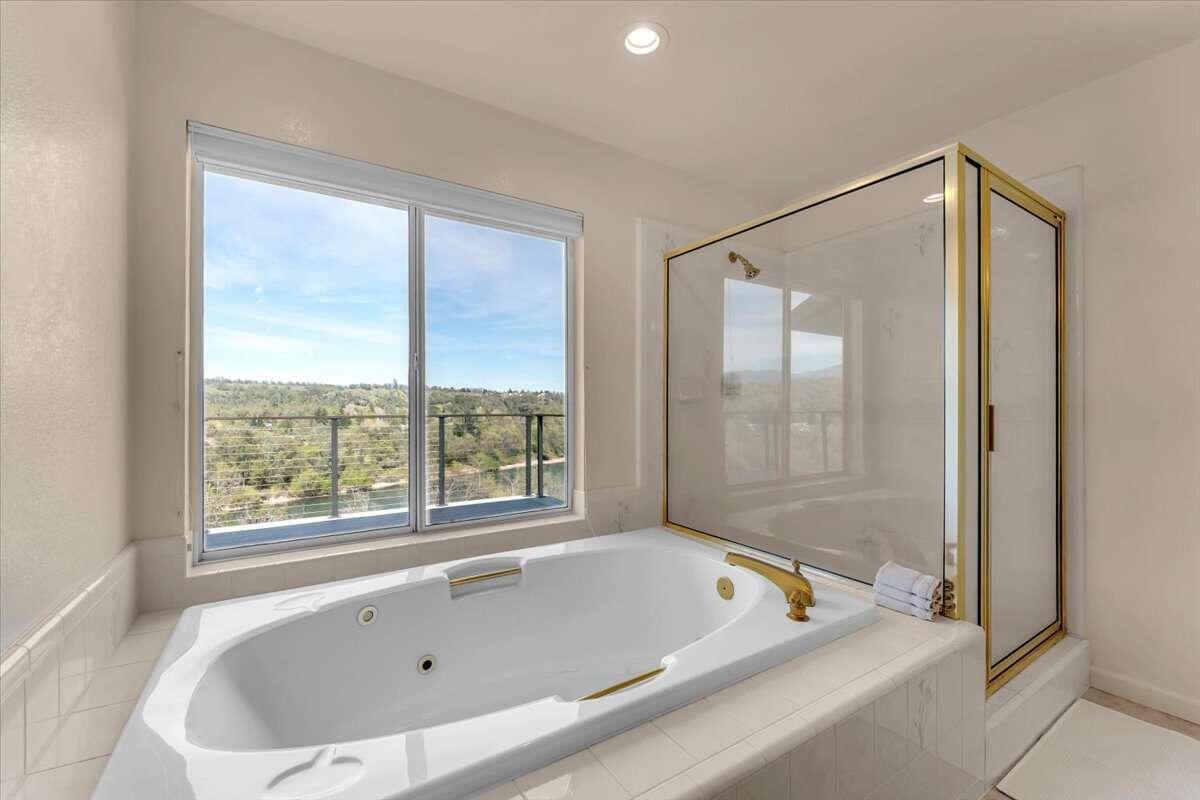 416 Arbor Place Redding, CA 96001 - Photo 31 of 31 a bathroom with a bath tub and a shower