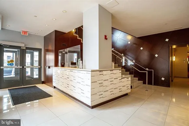 a view of a terrace with dining table and chairs