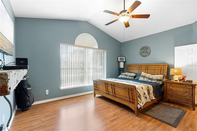 a spacious bathroom with a double vanity sink mirror and bathtub