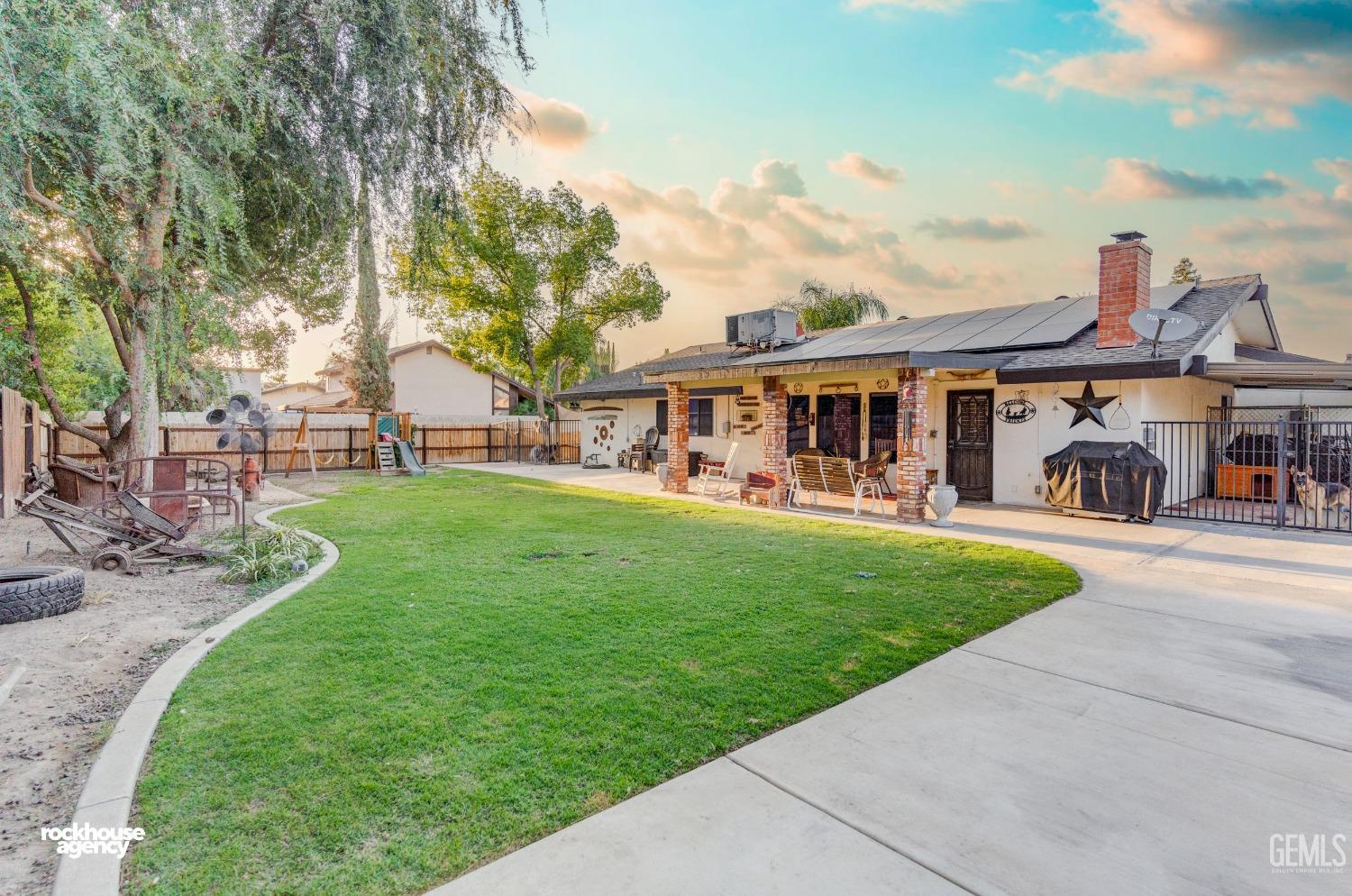 Undisclosed Address Bakersfield, CA 93309 - Photo 20 of 27 a view of a house with a yard