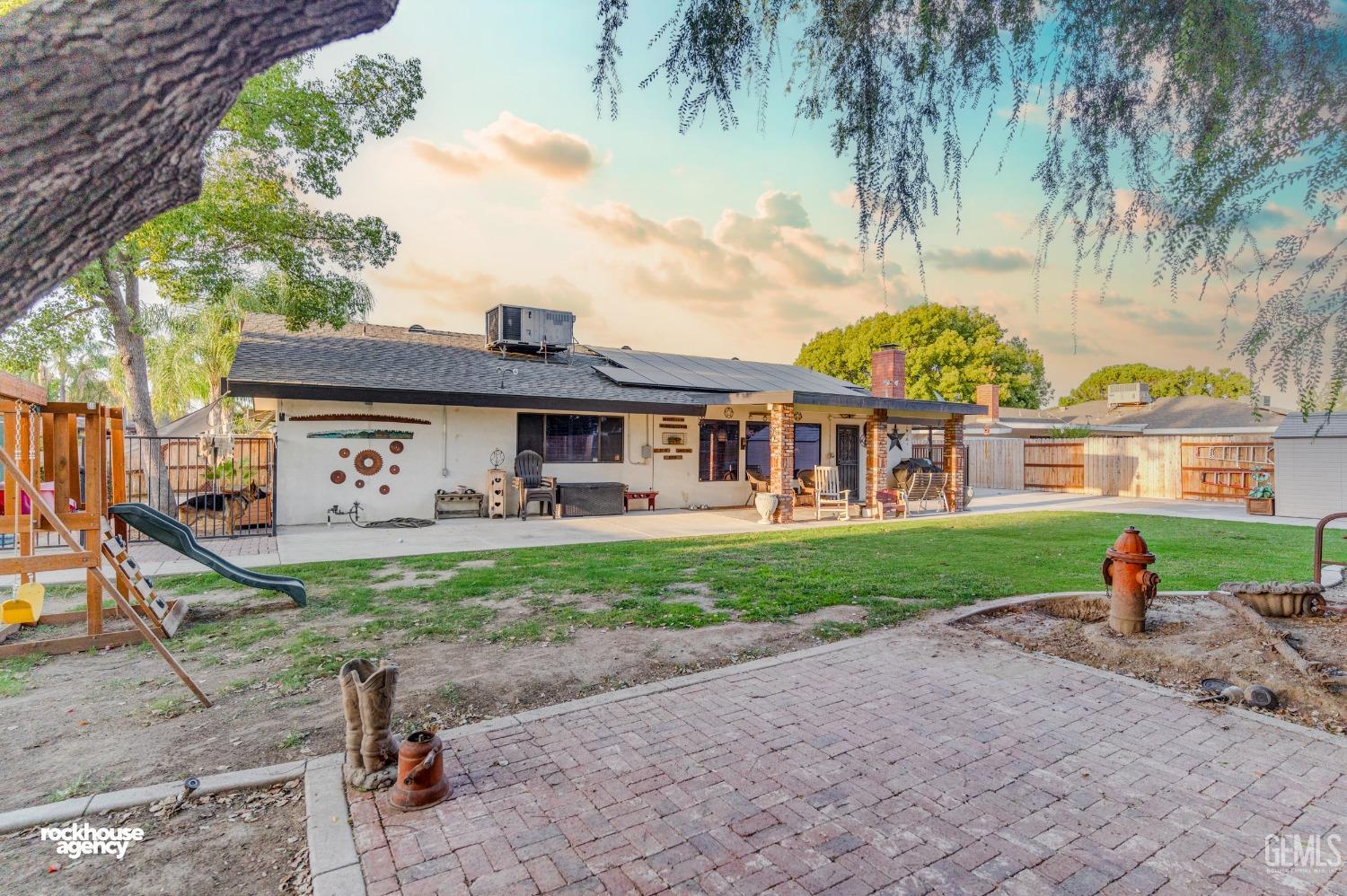 Undisclosed Address Bakersfield, CA 93309 - Photo 25 of 27 a view of a big house with a big yard and large trees