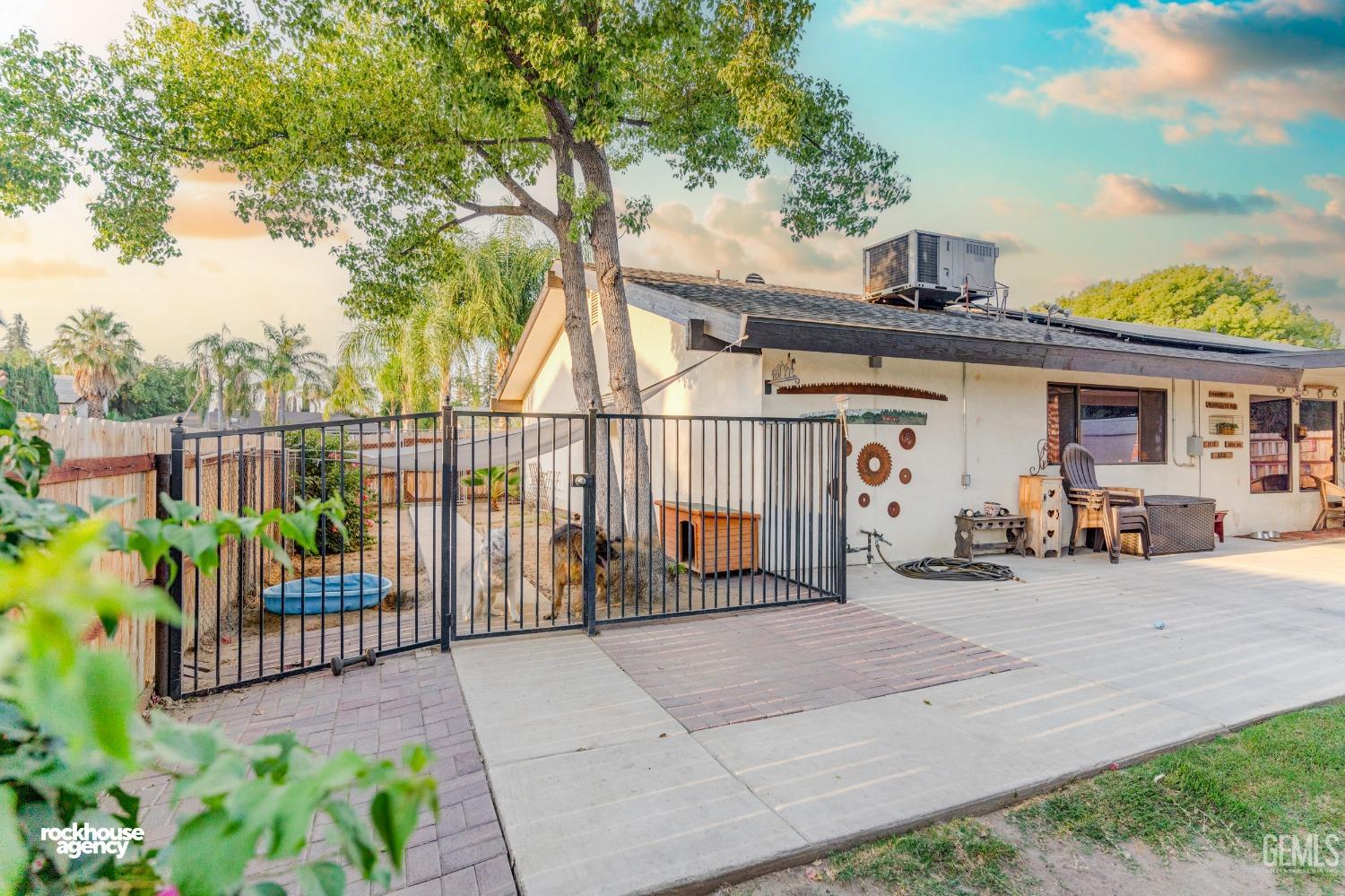 Undisclosed Address Bakersfield, CA 93309 - Photo 26 of 27 a view of a chair and tables in the patio