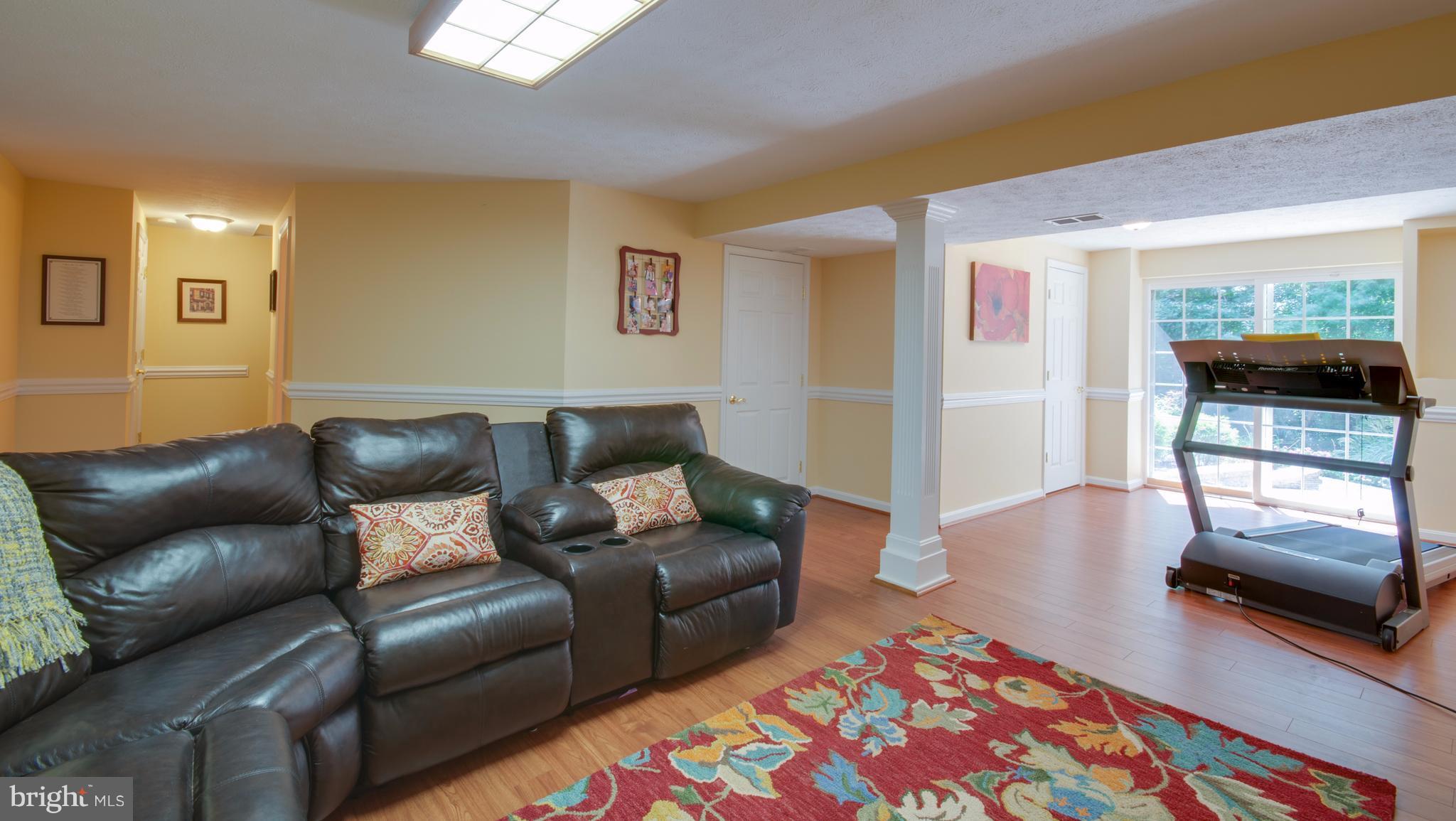 1449 Tar Point Road Pasadena, MD 21122 - Photo 22 of 30 Basement rec room with walkout to patio