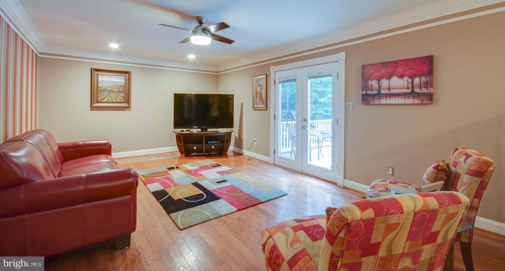 1449 Tar Point Road Pasadena, MD 21122 - Photo 7 of 30 Family Room opens to outdoor deck