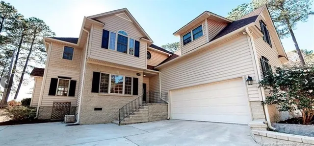 a view of a house with a garage
