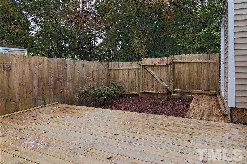 7705 Sandra Lane Raleigh, NC 27615 - Photo 7 of 12 HUGE deck offers tons of entertainment and grilling options!
