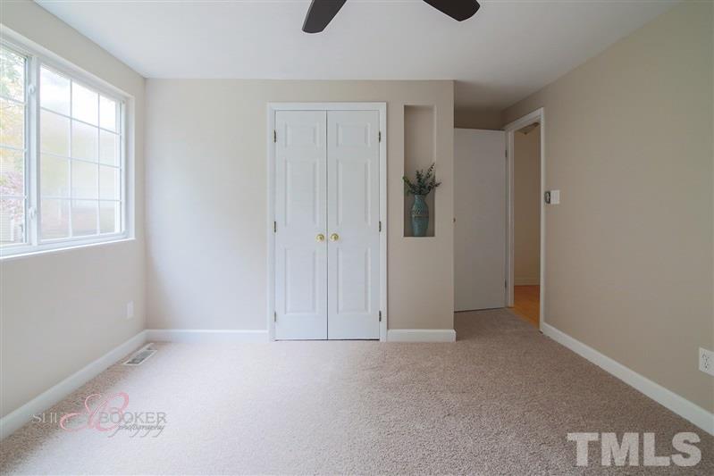 7705 Sandra Lane Raleigh, NC 27615 - Photo 8 of 12 Large master with double window is bright and airy.
