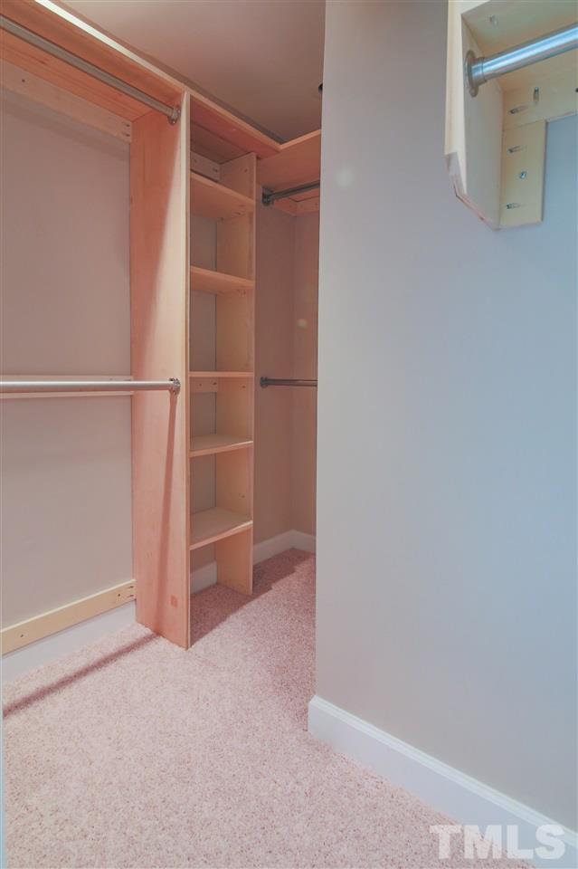 7705 Sandra Lane Raleigh, NC 27615 - Photo 10 of 12 Custom built walk in closet offer plenty of room for clothes and accessories.