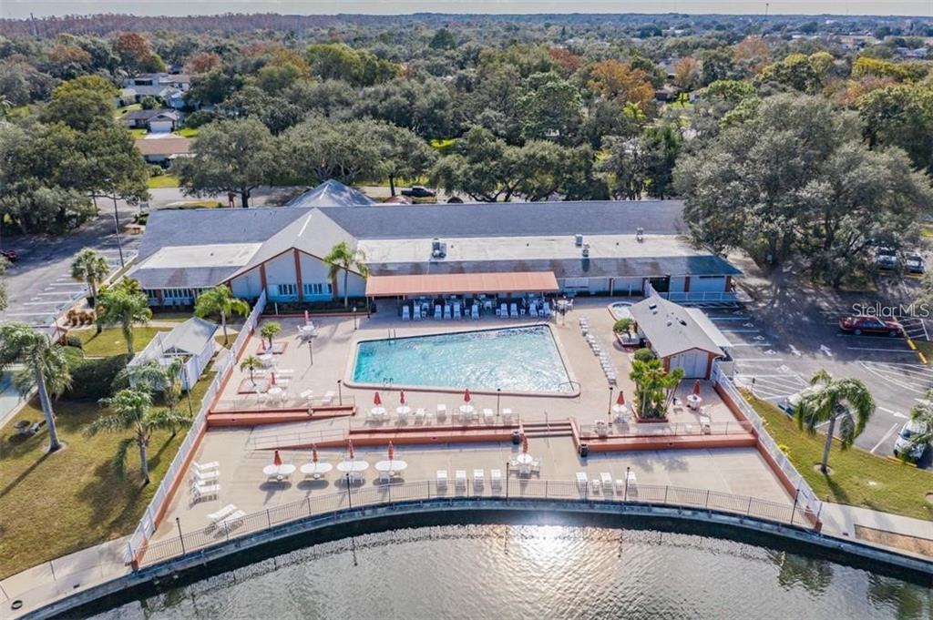 11308 Versailles Lane, Unit C Port Richey, FL 34668 - Photo 33 of 33 an aerial view of a house with swimming pool