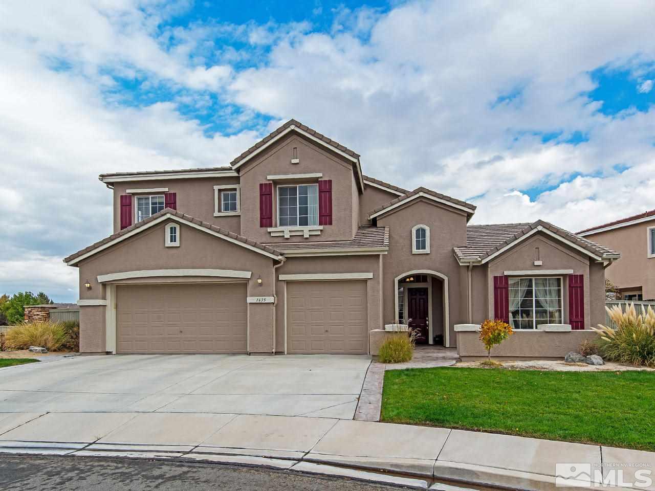 1635 Crater Court Reno, NV 89521 - Photo 1 of 25 a front view of a house with a yard