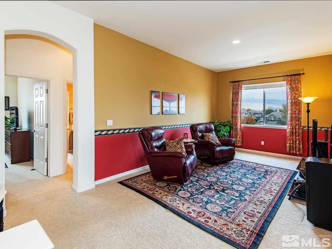1635 Crater Court Reno, NV 89521 - Photo 14 of 25 a living room with furniture and a rug