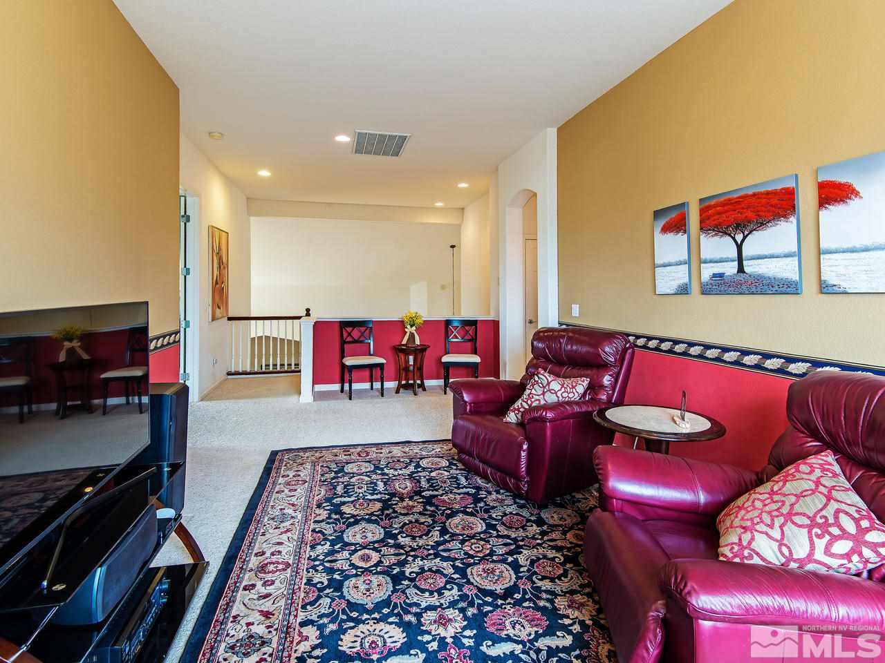 1635 Crater Court Reno, NV 89521 - Photo 15 of 25 a living room with furniture and a flat screen tv