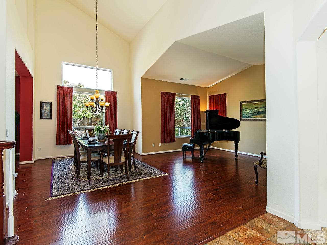 1635 Crater Court Reno, NV 89521 - Photo 2 of 25 a view of a dining room with furniture and wooden floor